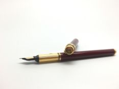 Cartier fountain pen, red lacquer case, gilt detail, trinity bands to lid, Cartier marked 18ct