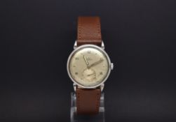 A GENTLEMEN'S STAINLESS STEEL OMEGA AUTOMATIC BUMPER WRIST WATCH. Circa 1940s. The dial is cream