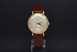 A OVERSIZED GENTLEMANS JAEGER LE COULTRE 18 KT GOLD WRIST WATCH. Cream coloured dial with a