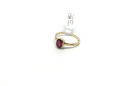 Ruby ring, oval cut ruby, rub over set in yellow metal tested as 9ct, ring size Q