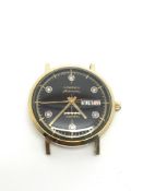 Gentlemen's 1950s Day Date Longines wristwatch. The movement is automatic. The dial is black with