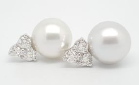 South Sea pearl and diamond earrings, 14mm South Sea pearl set under three round brilliant cut