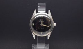 A GENTLEMEN'S W10 MILITARY HMT STAINLESS STEEL WRIST WATCH, black dial with luminous markers and