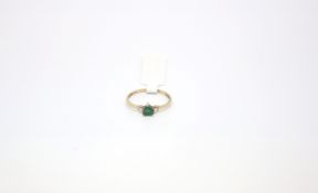 Green heart stone set ring, stamped and tested as 9ct, ring size R