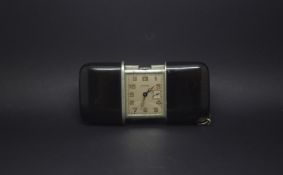 Vintage Movado Ermeto travel clock, black enamel case opens to reveal rectangular dial, Arabic
