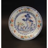 A Chinese Imari plate decorated with trees abd bamboo in a garden landscape, Kangxi period, 9''