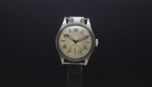 A Gentlemen's MILITARY WEST END WATCH IN STAINLESS STEEL. The dial has genuine patina for the age