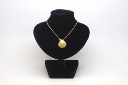 Tiffany & Co - Diamond set shell pendant, yellow gold shell pendant set with a single brilliant