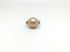 A 14ct White gold pearl ring with rose cut diamond shoulders, Size I 1/2