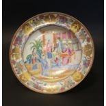 A Canton famille rose dish, circa 1840, painted with figures at leisure on a garden terrace, 25cm