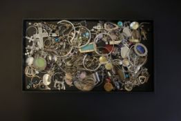 A selection of mostly silver pieces of jewellery, pendants, earring and stone set items Gross Weight