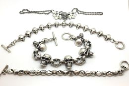 Four Silver Skull pieces of jewellery. Three marked 925. 267.7g
