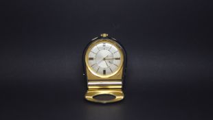 Vintage Jaeger LeCoultre Memovox travel alarm clock, silvered dial with gilt markers, inner rotating