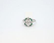 Art Deco emerald and diamond ring, the four central marquise cut diamonds surrounded by a calibre