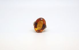 A large citrine and diamond ring. Stamped 18K. Size M 1/2