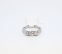 Diamond three stone ring, three brilliant cut diamonds estimated weights 0.30ct, 0.52ct, 0.29ct