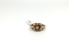 A golden zircon and white stone ring in yellow metal. Size K 1/2