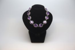 Amethyst and diamond cluster bracelet, ten oval cut amethysts 10.2x8.x, surrounded with round cut