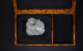 a Chinese carved white jade figure of a boy probably late Qing, 5.5cm*4.5cm, Good condition.