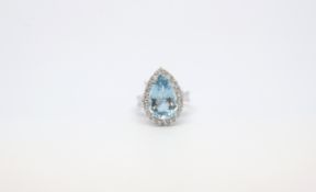 Aquamarine and diamond cluster ring, central pear cut aquamarine 15.7mm x 10.3mm, estimated weight
