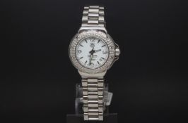 Ladies diamond set Tag Heuer F1, circular white dial, diamond set bezel, stainless steel case and