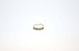 Emerald and CZ seven stone ring, set alternately, hallmarked 9ct, ring size P