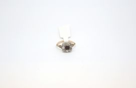 Victorian old cut diamond cluster, centre square cut only claw set within a cluster of eight white