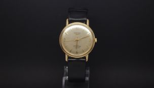 Gentlemen's 9ct Gold Longines Flagship watch. The movement is 17 jewel automatic. The dial is