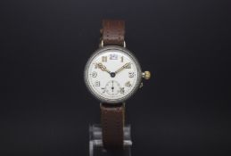 Gentlemen's silver trench watch. The dial is porcelain and displays a arabic numbers. There is