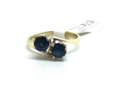A 14ct Gold Sapphire Bypass Ring. Size L. 2.6g