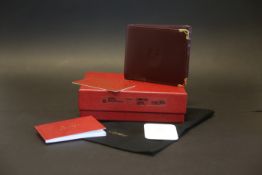 Cartier leather wallet, burgundy leather wallet with cartier emblem, red stitching, with Cartier
