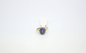 Vintage blue and white paste cluster ring, mounted in hallmarked 9ct, ring size N