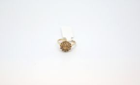 Yellow stone cluster ring, stamped and tested as 9ct, ring size M