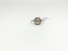 An old cut diamond cluster ring. The central old cut diamond approximately 1.30cts surrounded by a
