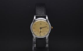 Vintage Tudor, circular champagne dial with applied Arabic numerals, subsidiary seconds dial,