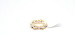 Three row abstract ring, set with round brilliant cut diamonds within three bands of yellow, white
