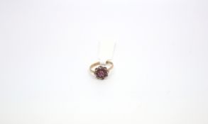 Garnet cluster ring, nine round cut stones, rope edge detail, mounted in yellow gold hallmarked 9ct,