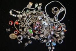 a selection of fashion designed charms and other silver marked bracelet/bangles, tested and marked