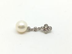 Pearl and diamond pendant, 7mm white pearl suspended from a diamond set bail by diamond set links,