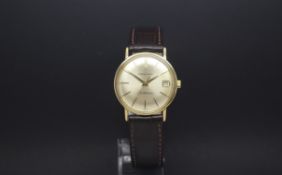 Vintage 18ct Eterna-Matic, silvered dial with gold baton hour markers, date aperture, 34mm gold