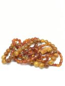 Amber necklace, 11mm reconstituted amber beads, along with two orange bead necklaces and a pendant