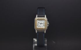 Ladies Cartier Santos automatic, white square dial, steel and gold case, blue Cartier leather