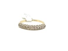 Diamond half eternity ring, ten stones set in yellow and white metal, stamped and tested as 9ct,