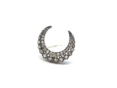 Victorian old cut Diamond crescent brooch. Set in silver and gold. Approximate Total carat weight: