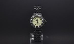 Ladies Heuer, luminous dial, date aperture, rotation outer bezel, 28mm black case, stainless