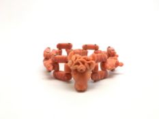 An Impressive Carved Coral Bracelet. 18cm in length. The carved coral depicting figurines: a male