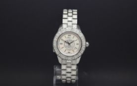 Ladies Dior "Christal" Diamond set bezel mother of peal dial plus a faceted stone link stainless