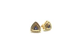 Tanzanite and diamond set stud earrings, brilliant cut tanzanite set with a border of round cut