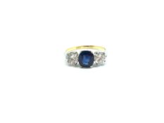 A sapphire and diamond set ring. The central 1.64ct Sapphire complete with GCS certificate stating