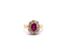 A burmese ruby and diamond ring. The 1.38ct oval cut ruby (7.20 x 5.17 x 3.79mm) complete with